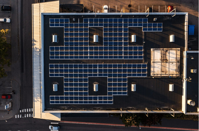 Solar panels on commercial flat roof ariel view 2